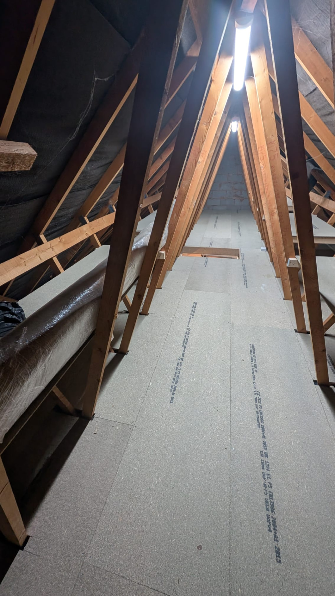 Same loft after Loft Kings raised boarding install, flush chipboard floor with LED strip lighting