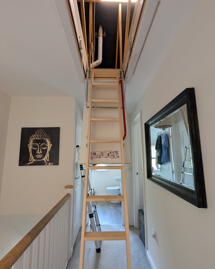 Boarded loft walkway between trusses, professional install