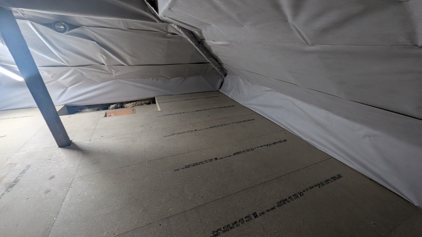 Loft boards installed across full attic with bracing