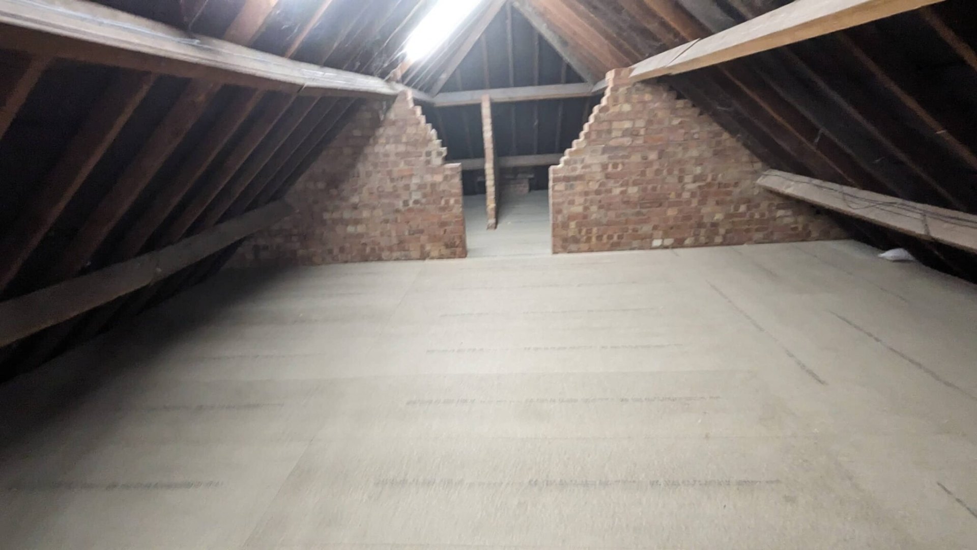 Loft boarding completed with central walkway and storage zone