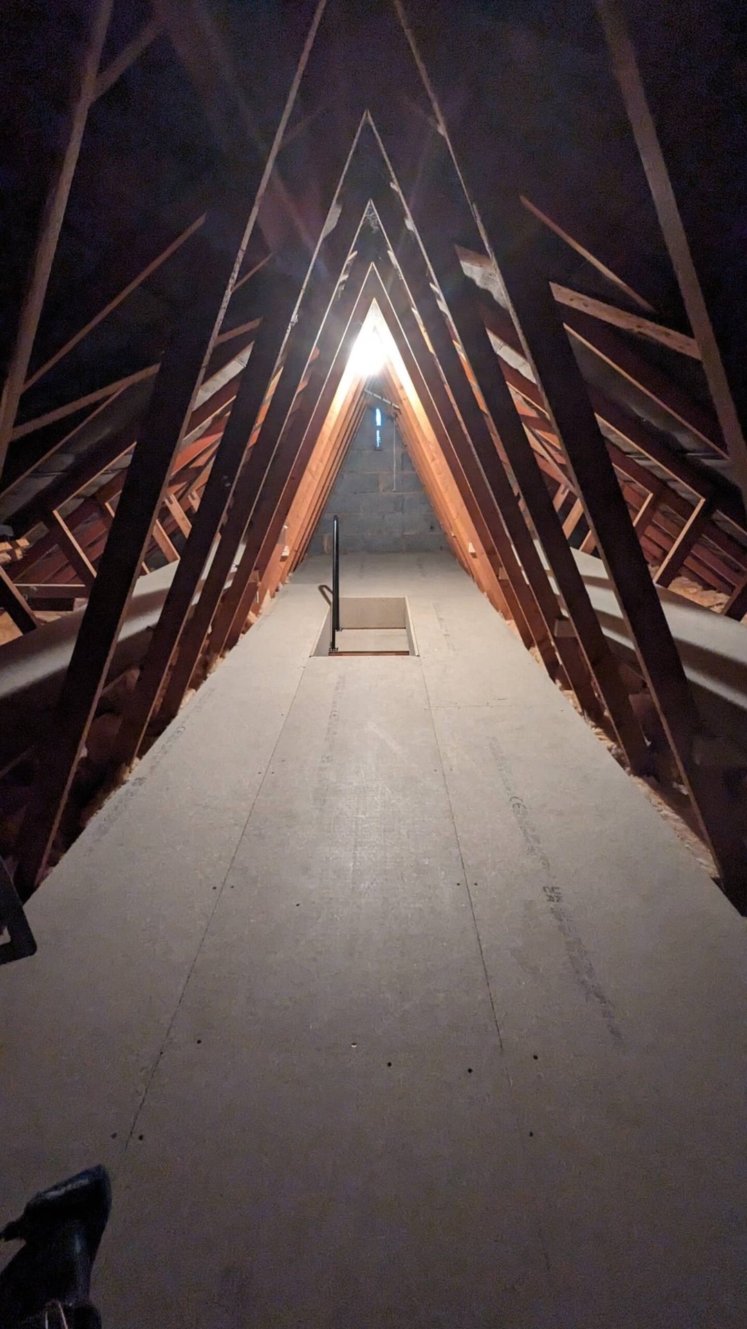 Boarded loft floor in trussed roof, full coverage install