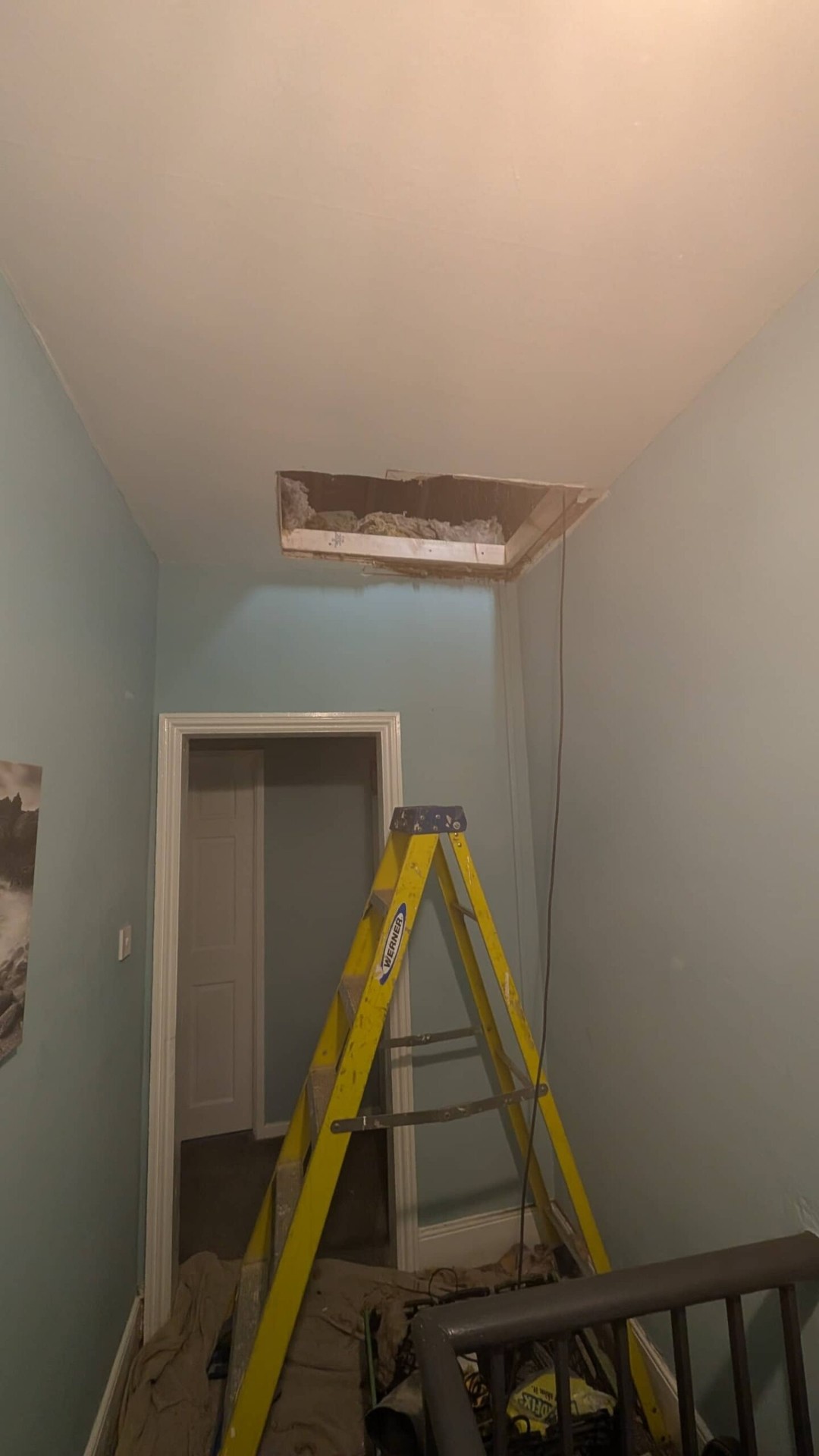 New loft hatch opening cut into landing ceiling ready for install