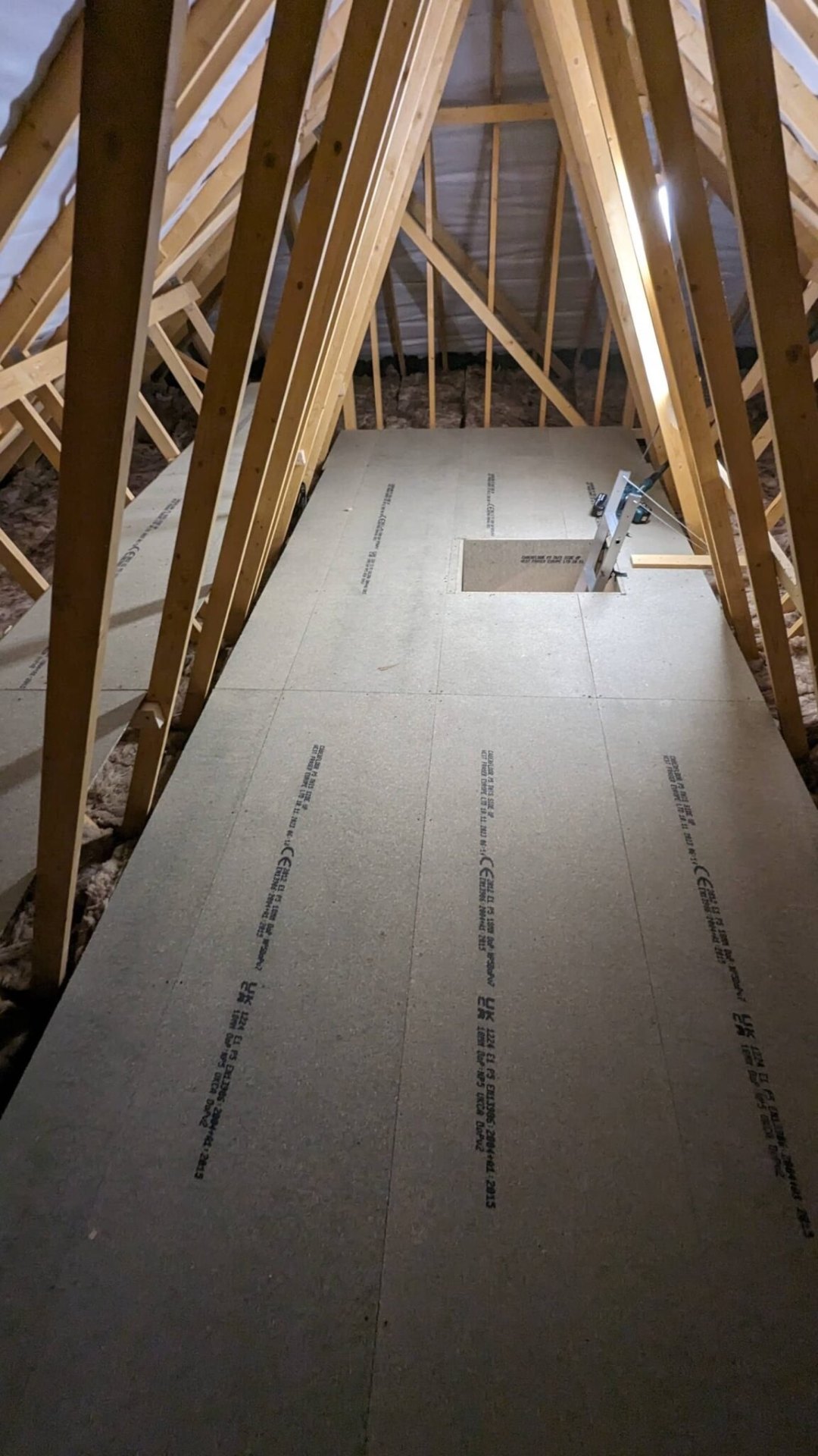 P5 moisture-resistant chipboard loft boards laid over raised system, West Midlands