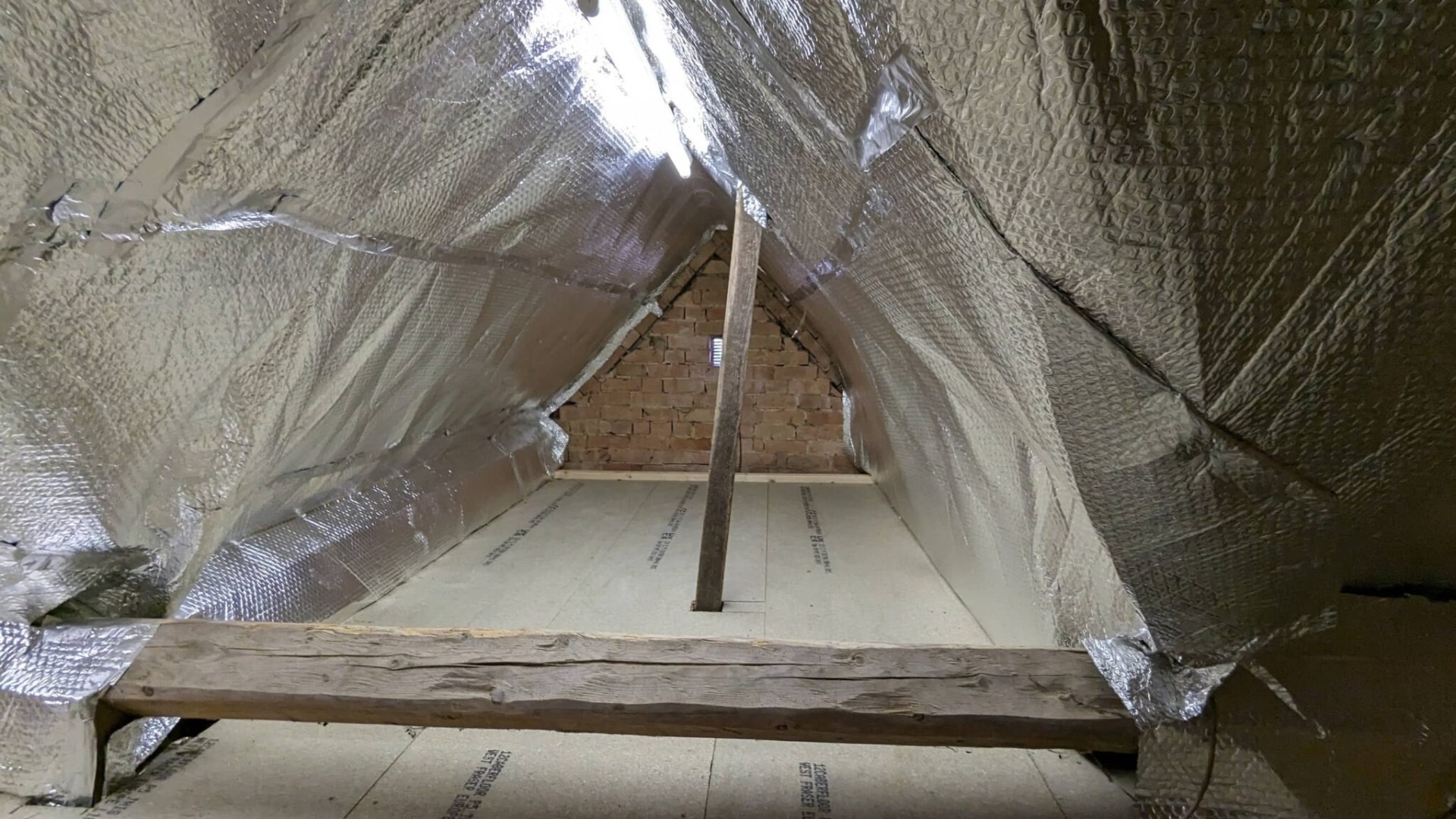Reflective foil insulation lining fitted across full roof slope
