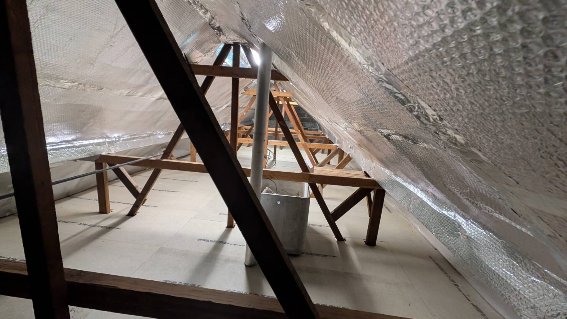 Multi-layer foil insulation lining with finished boarded floor