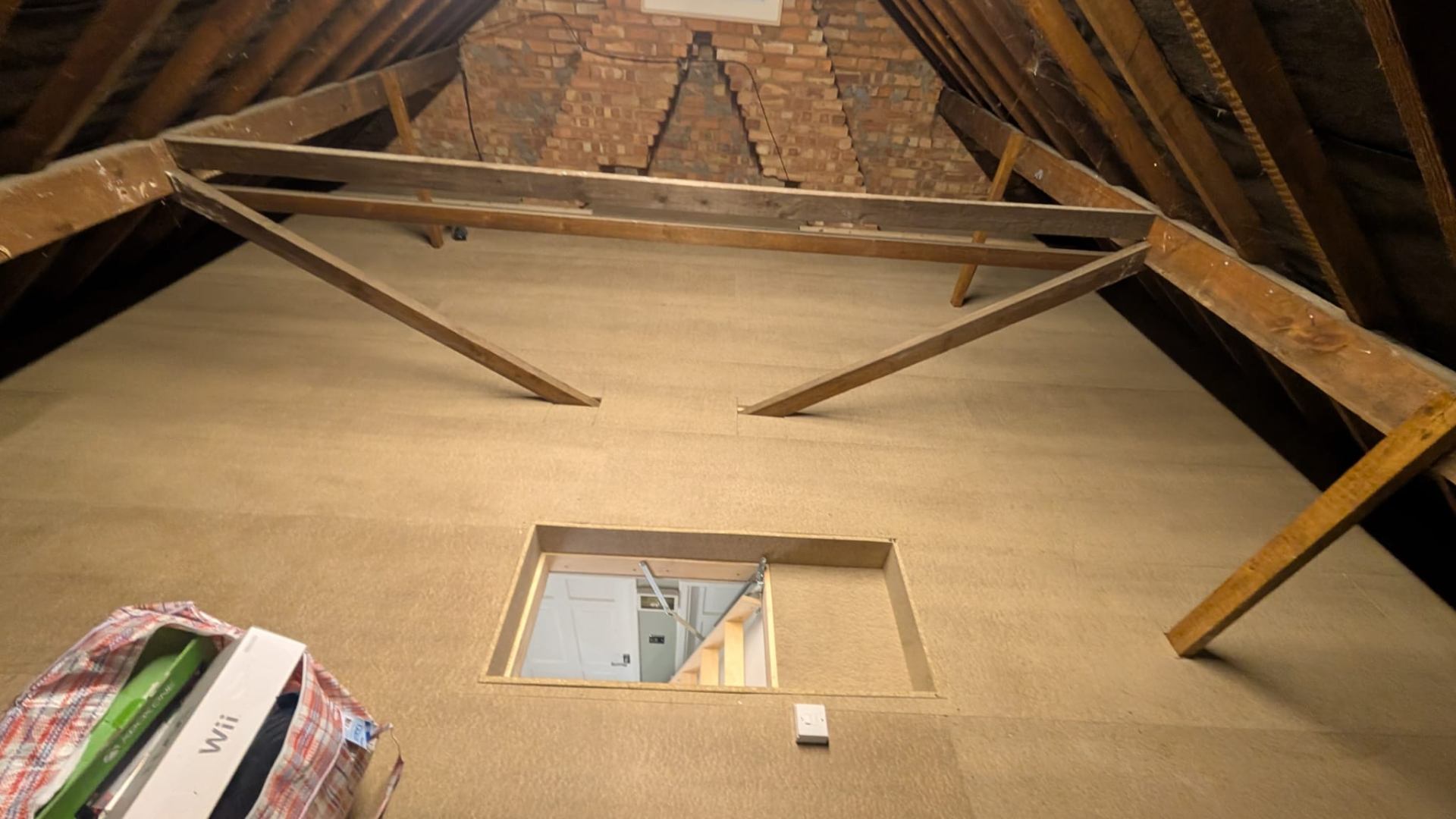 Boarded loft with new hatch opening cut into landing ceiling, Solihull