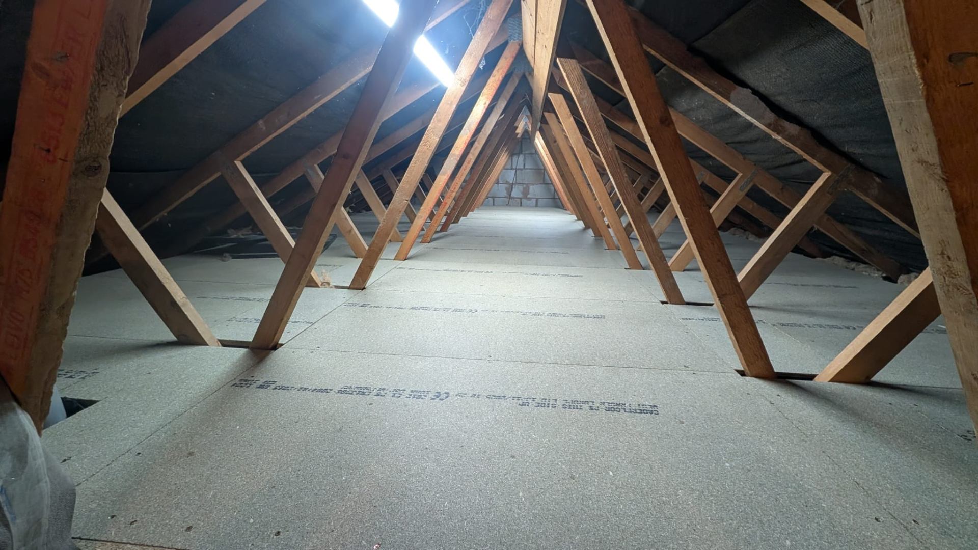 Wide-angle loft boarding completed across full attic floor