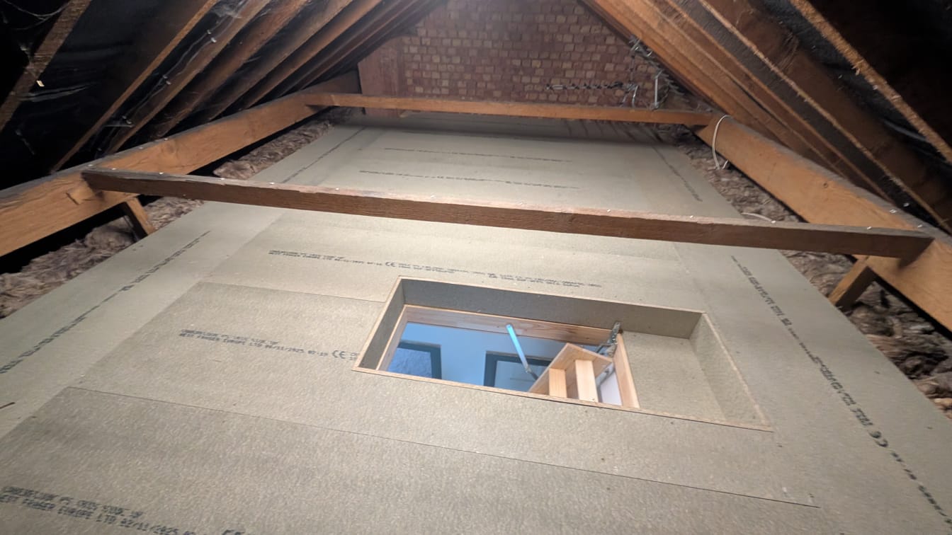 Boarded storage area with adjacent original insulation