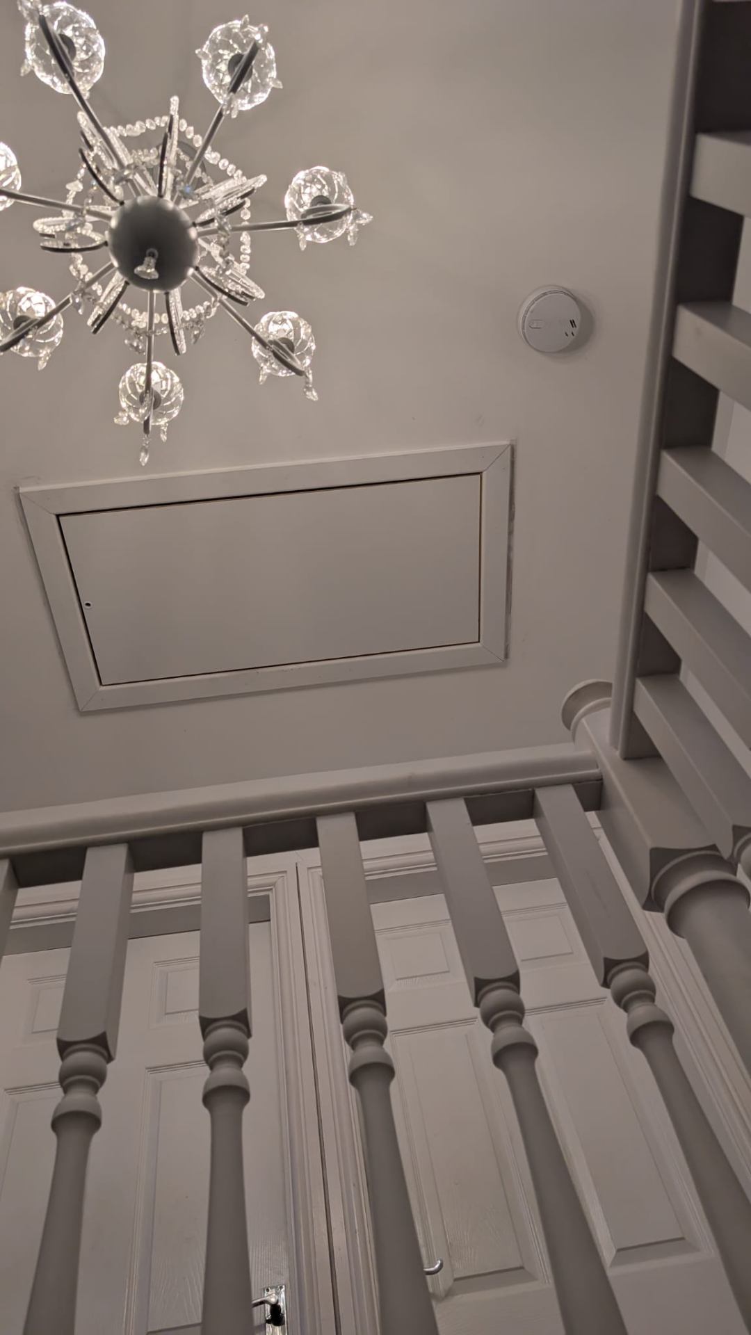 Newly fitted insulated white loft hatch flush to landing ceiling