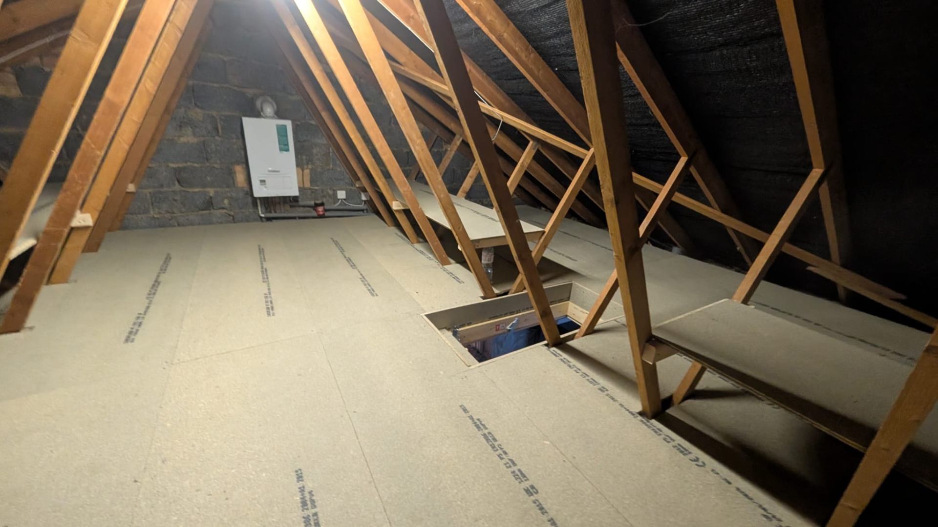 Boarded loft floor with hatch and ladder access fitted