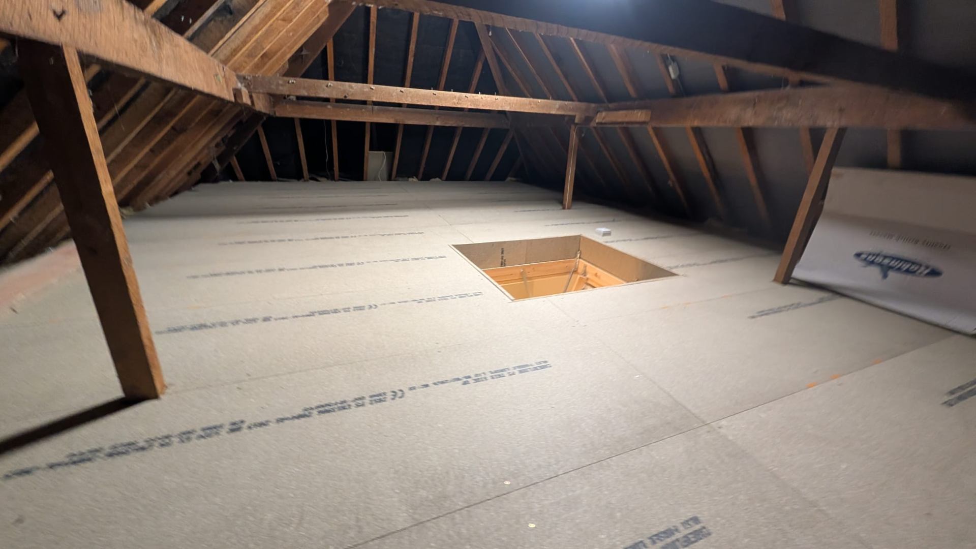 Loft boarding around pipework with clean access cuts