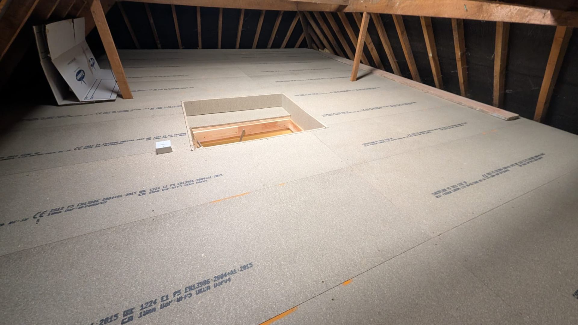 Loft boards laid over raised sub-frame system