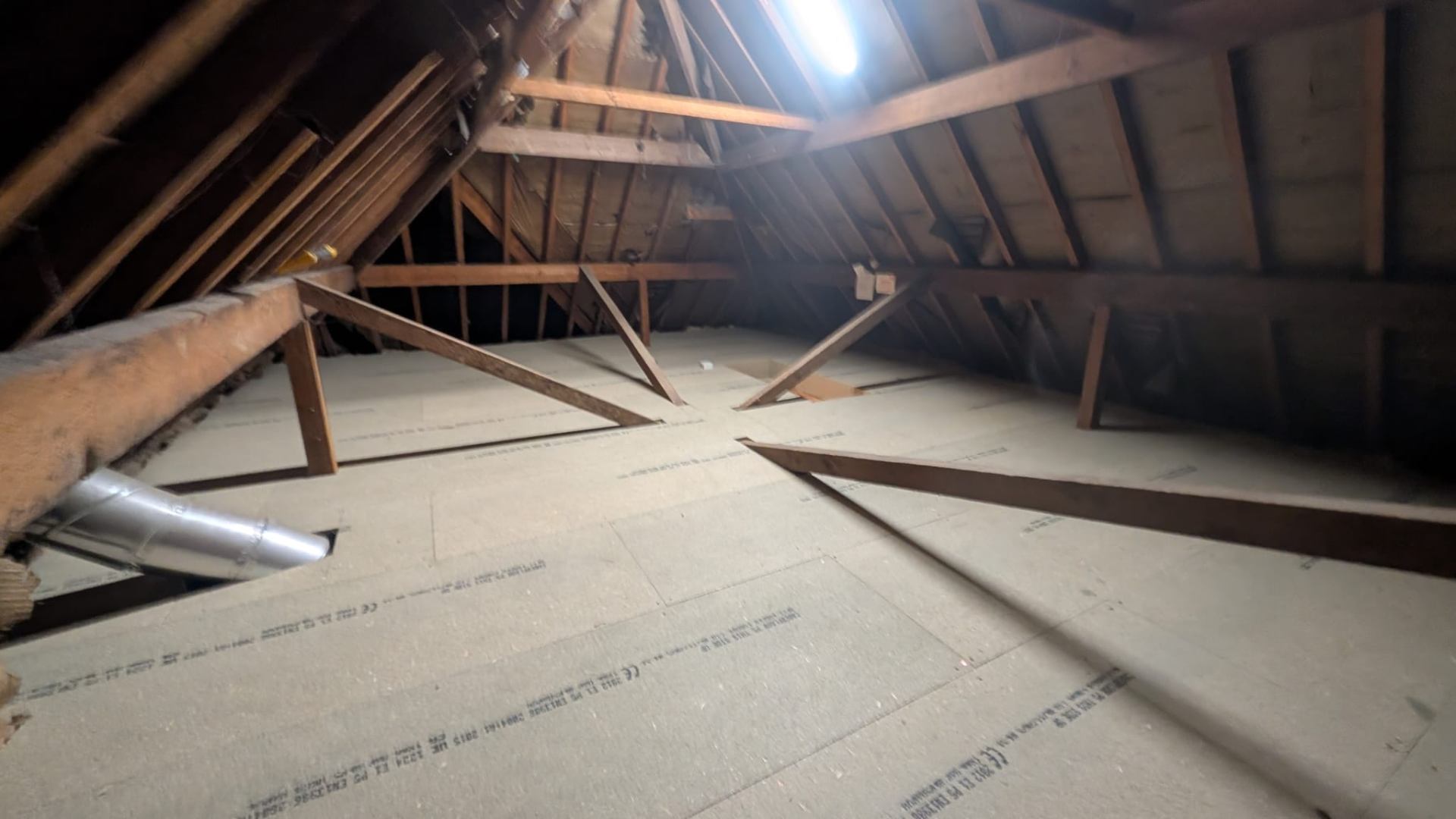 Boarded loft floor with bracing timbers, Solihull install