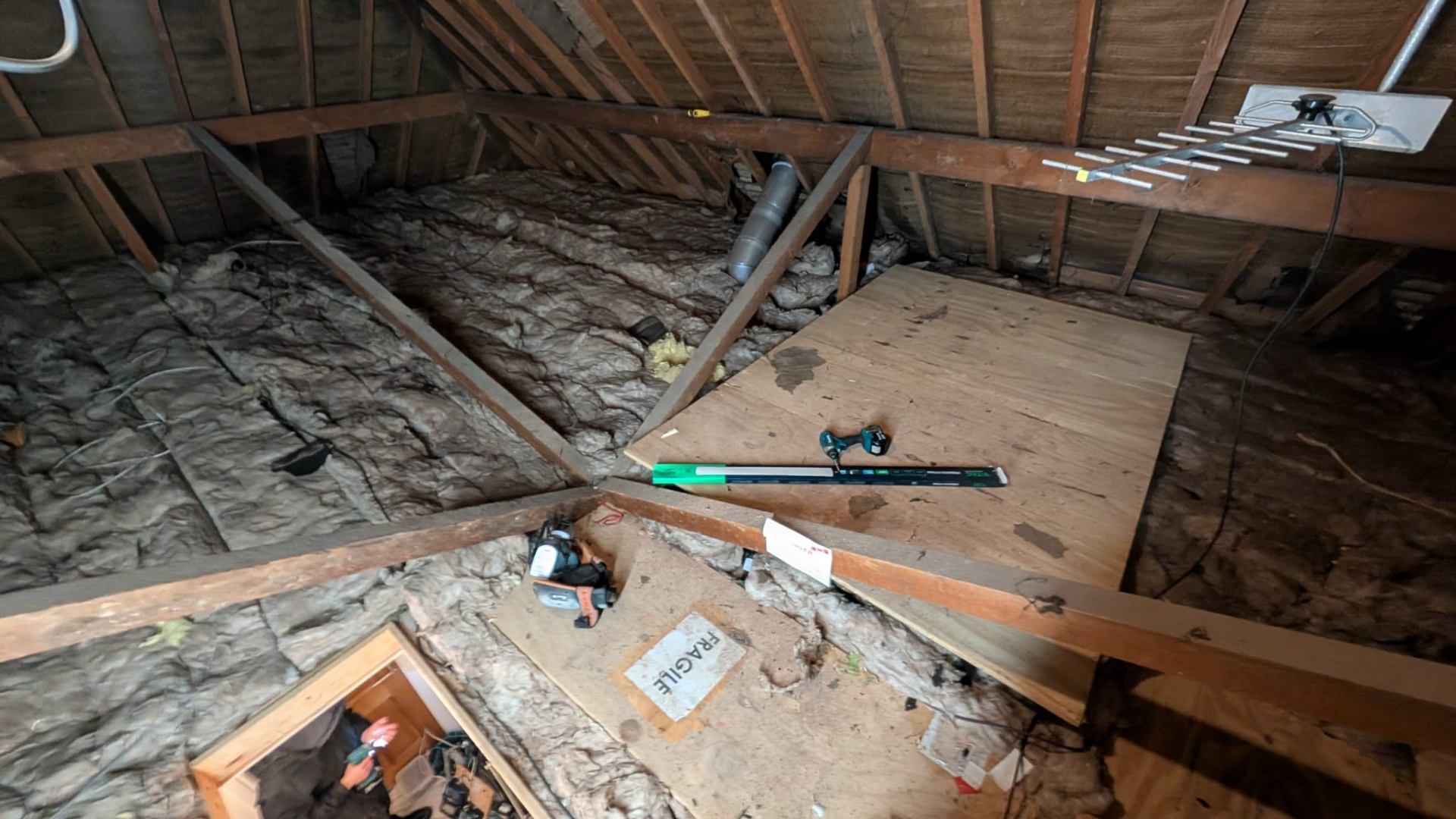 Original mineral wool loft insulation laid between joists, Solihull survey
