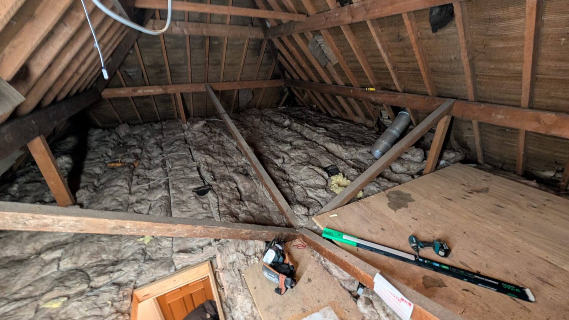Original loft insulation in place before clearance and re-board